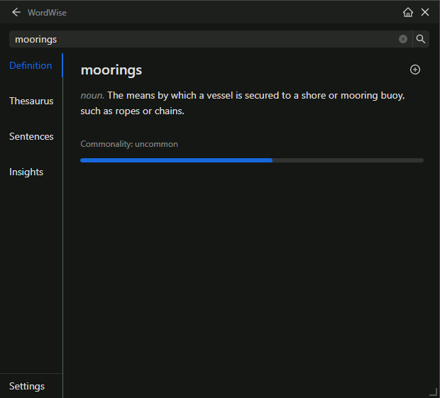 The WordWise popup showing the definition of moorings: the means by which a vessel is secured to a shore, with a commonality meter reading uncommon